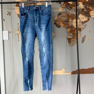 Med was distressed high rise skinny denim jeans